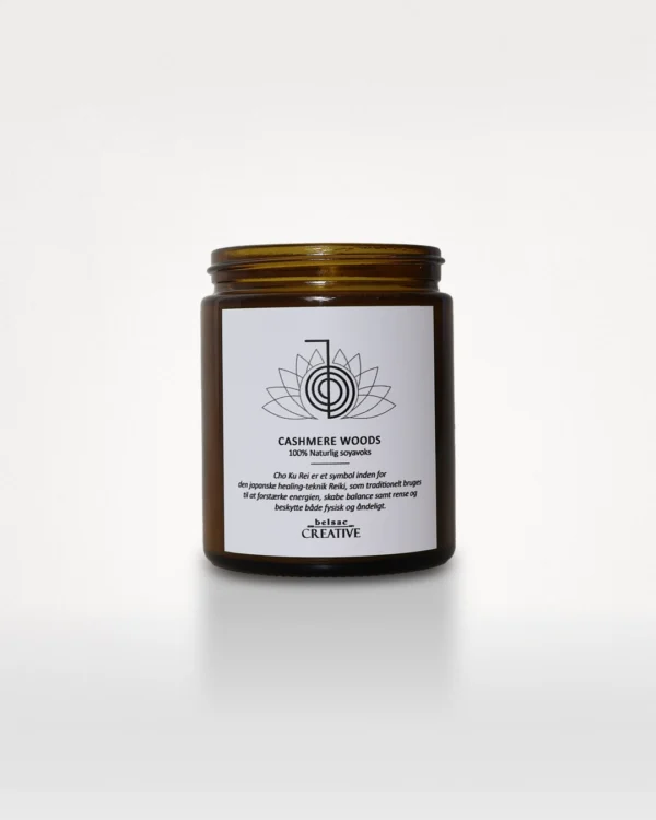 Duftlys Cashmere Woods i amberfarvet glas uden låg, set forfra