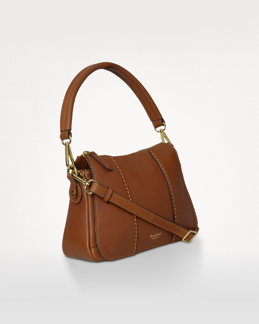 Philipa crossbody-taske i cognac, sideprofil med kort hank og lang rem